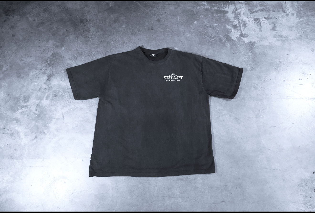 Front flat lay of the Dawn heavyweight tee in washed black, 250gsm acid-washed combed cotton