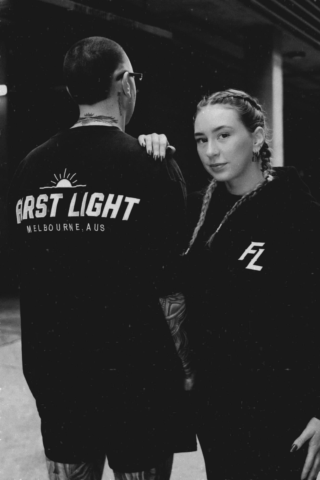 Black and white image of the Dawn heavyweight hoodie showing the embroidered FIRST LIGHT back graphic and FL chest mark